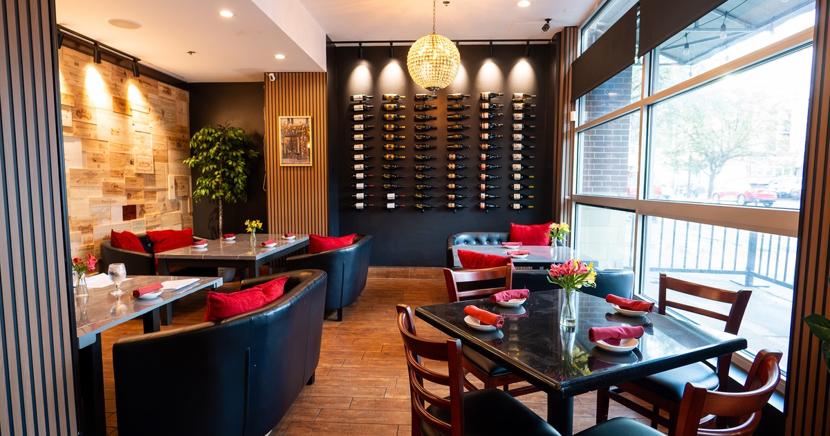 Cozy interior dining area with dining tables set for guests