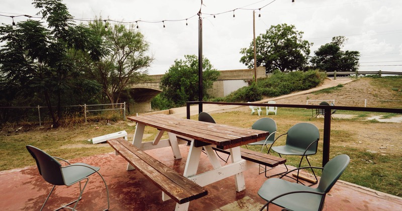 Exterior, wooden table with benches and chairs