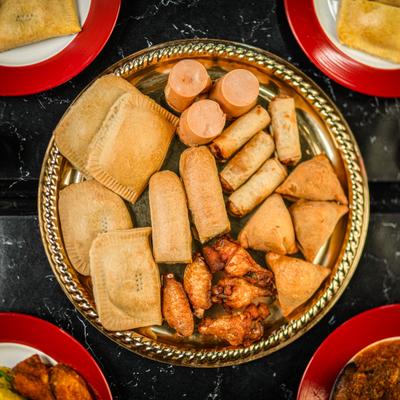 Assorted fried pastries and wings.