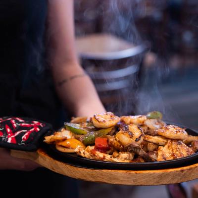 Chicken, shrimp, and steak Fajitas.