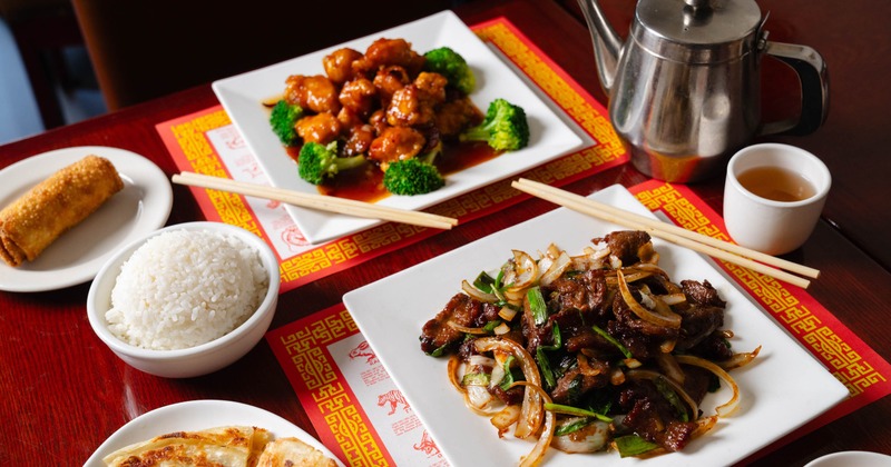 Mongolian beef and General Tso's chicken served with rice, egg roll, and tea