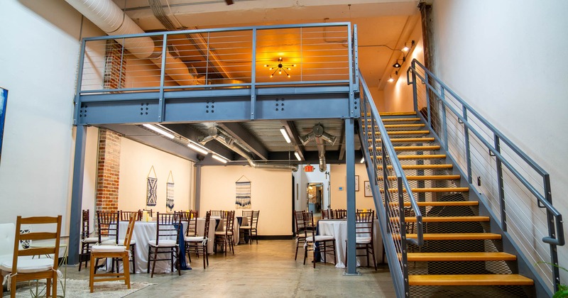 Interior, dining area with stairs leading to upper floor