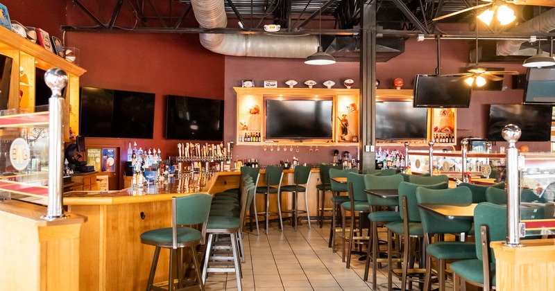 Interior, counter, LED screens, chairs, bottles, glasses, beer dispensaries, lights