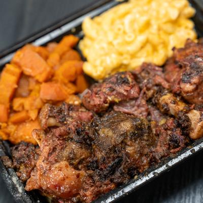 Jerk oxtail, with a side of sweet potatoes, and mac and cheese.