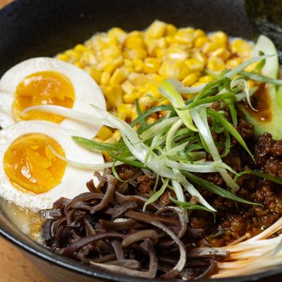 Miso Ramen with corn, boiled egg, mushrooms and scallions.