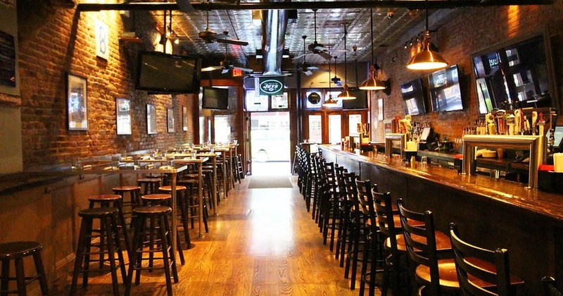 Interior, seating area with TVs on the wall