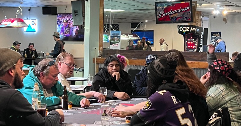 Group of people seaing at the table inside of the venue