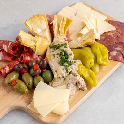 Antipasto board with vsriety of meats, cheses and pickled vegetables.