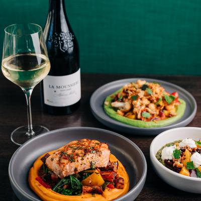 Multiple Plates and a bottle of Wine.