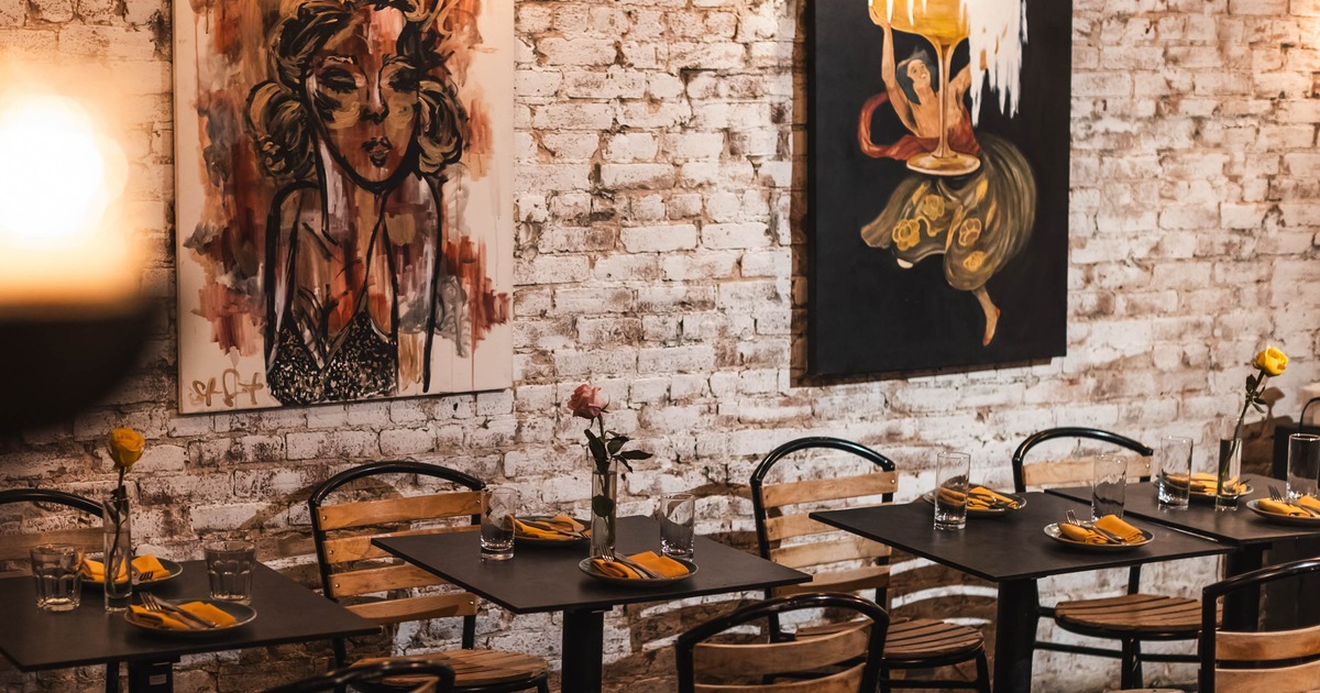Interior, dining area, metal tables with chairs, ready for guests, white brick walls
