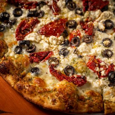 Basilica pizza, with cheese, olives and red peppers
