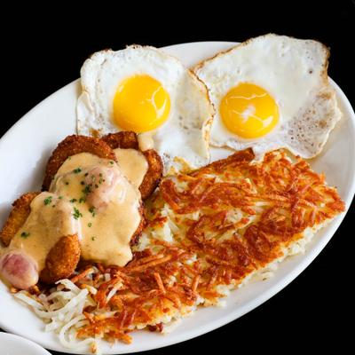 Fried green tomatoes, eggs and hashbrowns, top view.