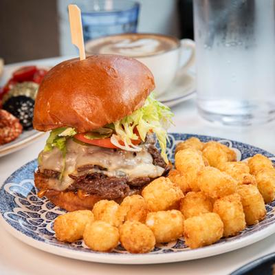 Juicy double cheeseburger on a brioche bun served with crispy tater tots.