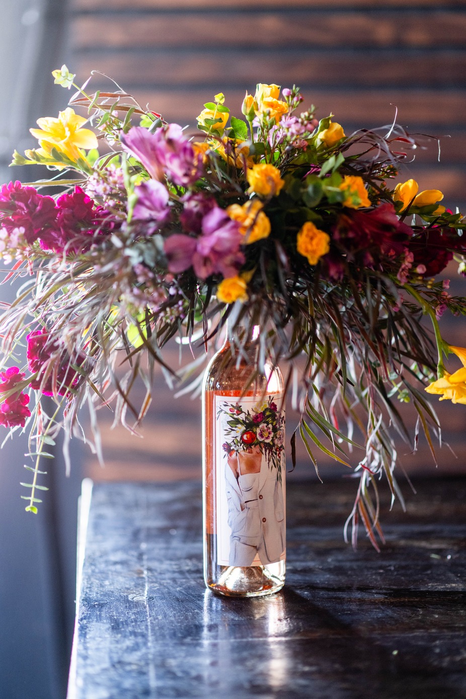 Sip and Design Wine Bottle Floral Arrangement event photo