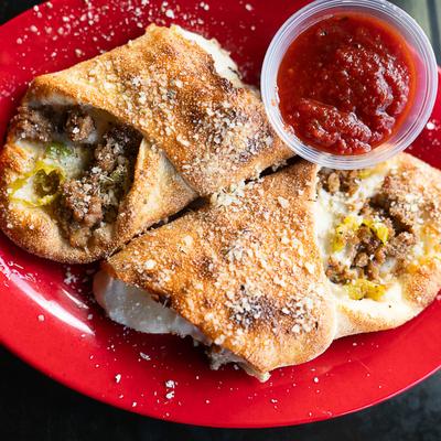 Sausage rolls with pepperoncini, shredded provolone-mozzarella cheese blend. and marinara.