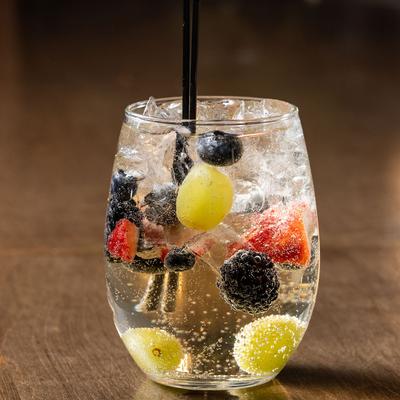 White sangria with fresh fruits inside the glass.