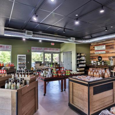Gourmet market  with wooden display crates filled with specialty foods.