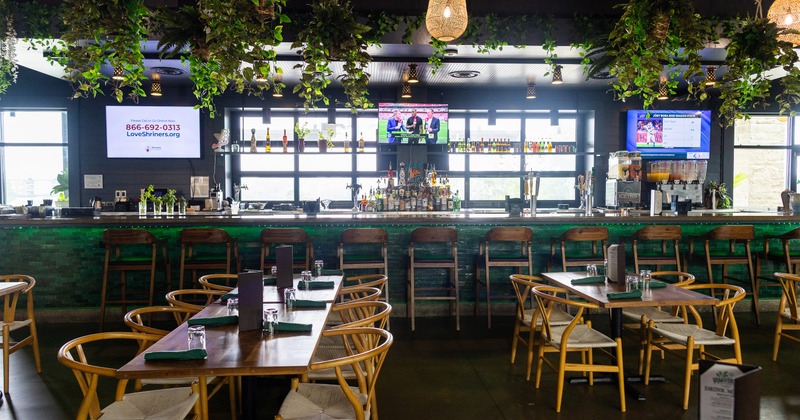 Diner area, in front bar and tv screens above
