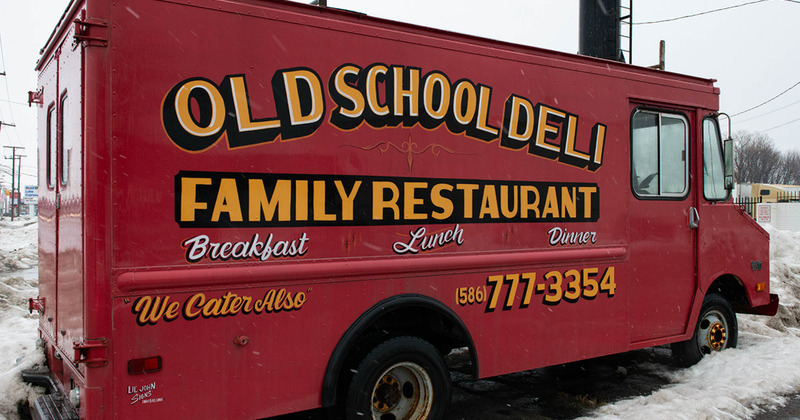 Van with restaurant logo