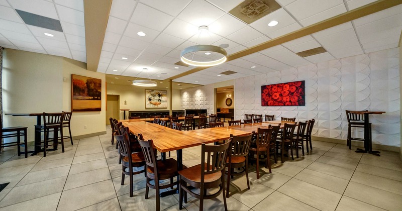 Interior, tables read for guests, pictures on the walls