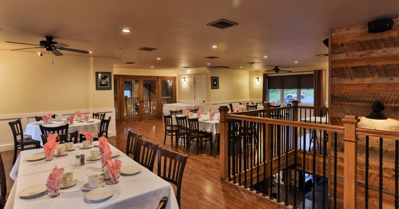 Interior view of a restaurant dining area with wooden floors