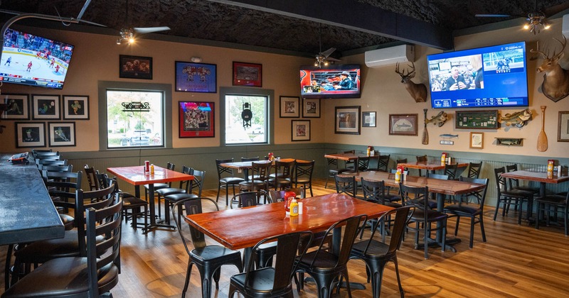 Interior, seating area, TVs on the walls, decoration