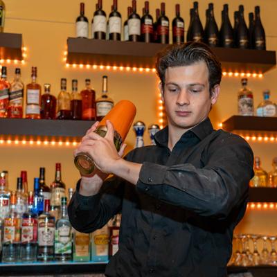 Bartender shaking a cocktail.
