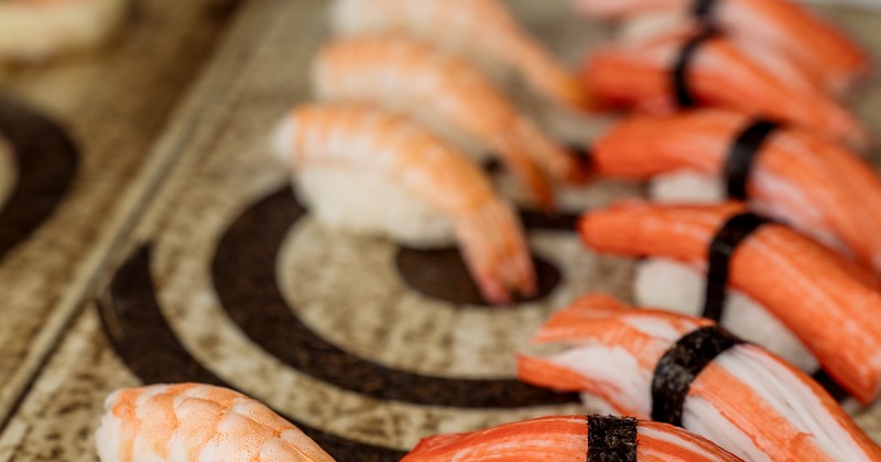 Shrimp and crab stick nigiri sushi arranged on a platter