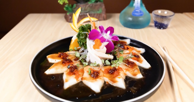 Escolar Sashimi served on the plate with various garnishes