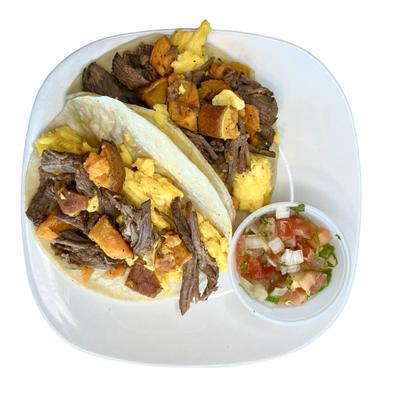 Beef breakfast tacos served with fresh salsa.