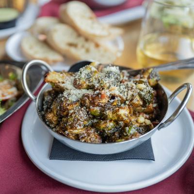 Sicilian Brussel Sprouts topped with grated Parmesan cheese.