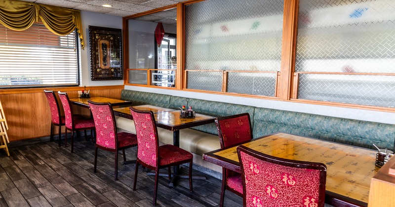 Cozy interior dining area with tables lined up