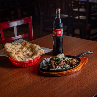 Beef Kebab, with naan bread, and Coca Cola.