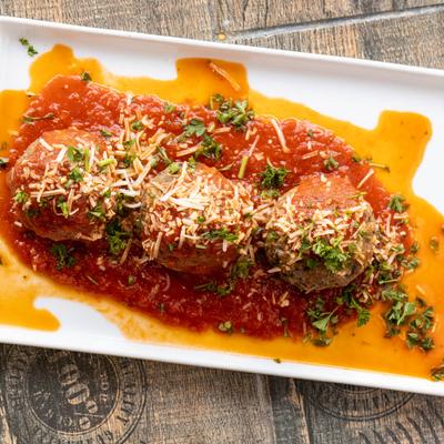 Vegan meatballs in marinara sauce.