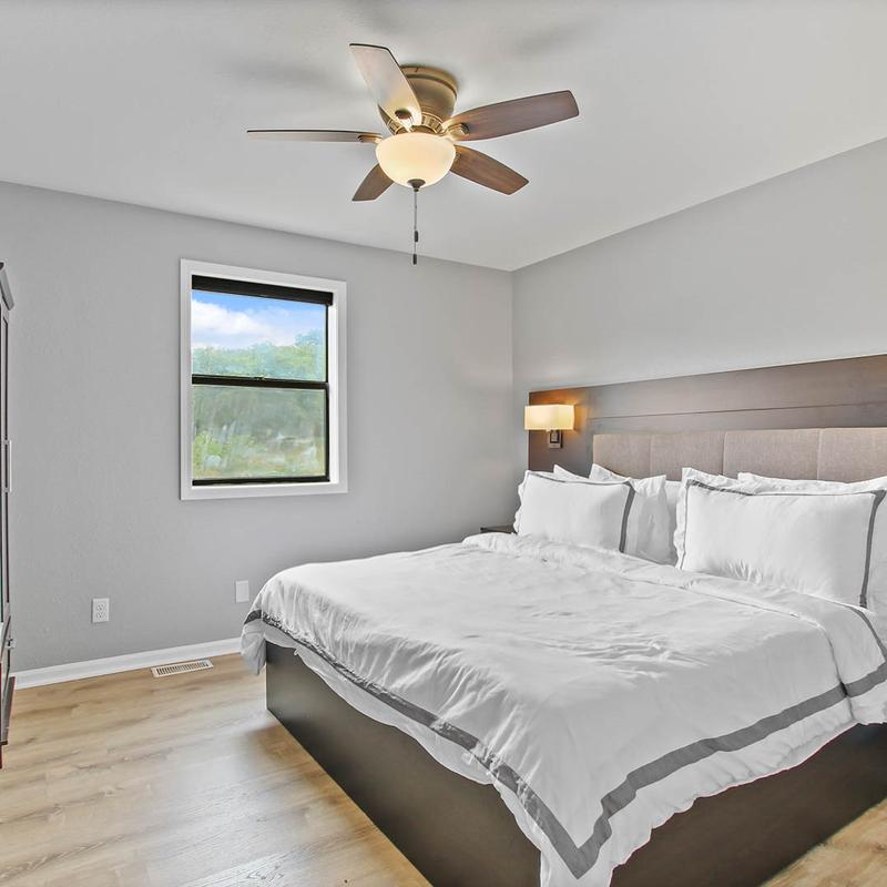 A couple's bed in a bedroom.