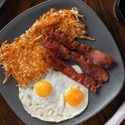 Fried eggs, bacon, and hash browns.