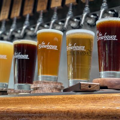 5 Brewhouse beers sitting below tap handles.