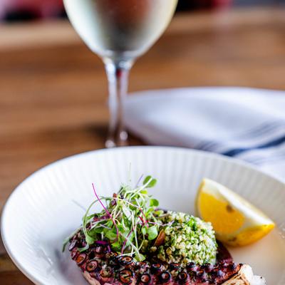 Grilled octopus and a drink.
