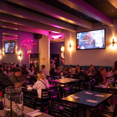 Dining area with guests seating at tables.