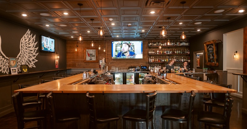 Interior, bar, front view, tv screen behind