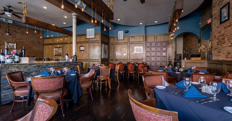 Interior, tables ready for customers, a bar