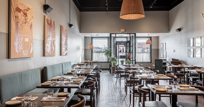 Restaurant interior, dining area with set dining tables