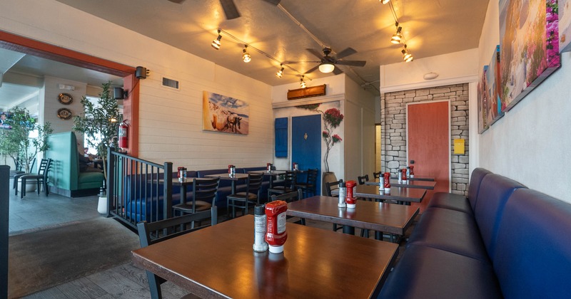 Interior, dining area with blue leather sofas