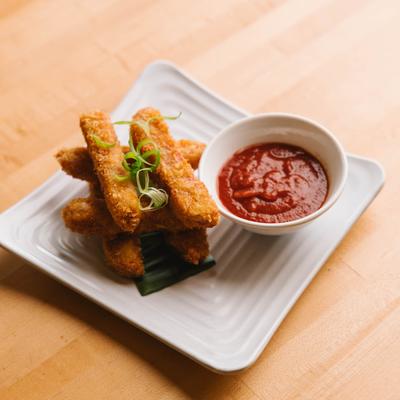 Spam fries served with dipping sauce.