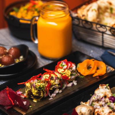 Meatballs and Mango Lassi drink.
