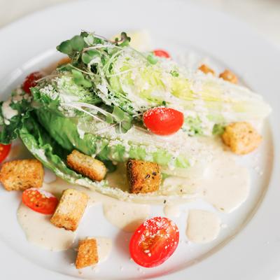 Caesar salad with romaine, croutons, Parmesan, and cherry tomatoes