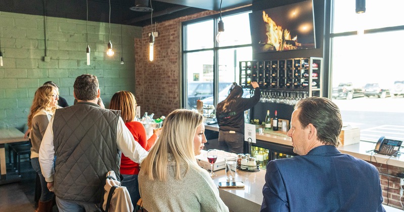 Interior, bar area with guests chatting