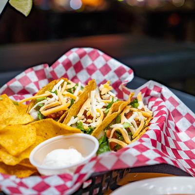 Served tacos with chips.