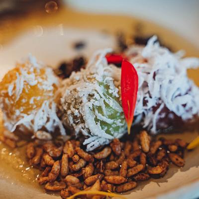 Thai rice cake with young coconut and palm sugar syrup.