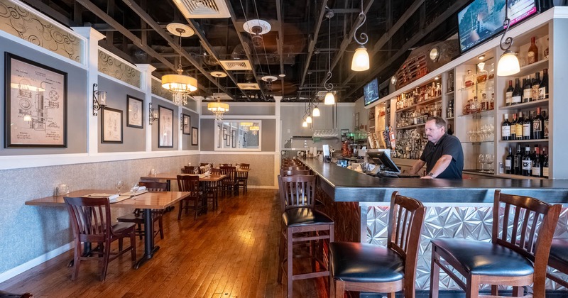 Interior, a seating area , tables and chairs ready for guests